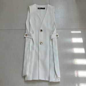 White with gold button up the center.